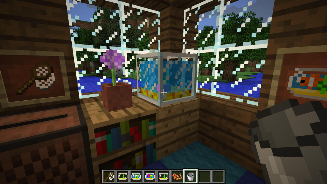 Fish tank filled with a water bucket.